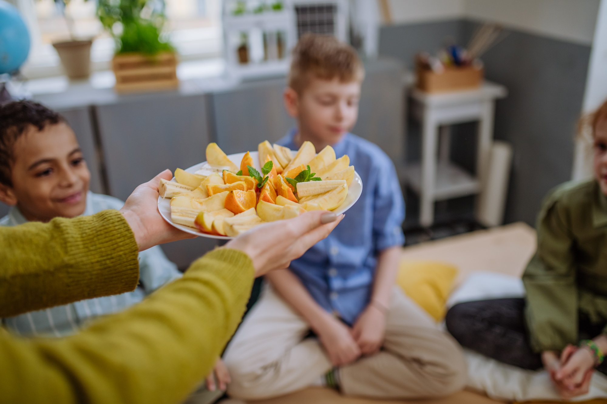 Close up of healthy fruit snack for pupils.
