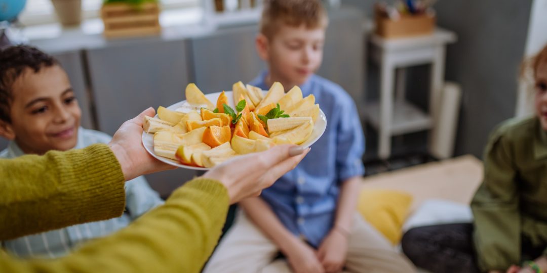 Close up of healthy fruit snack for pupils.